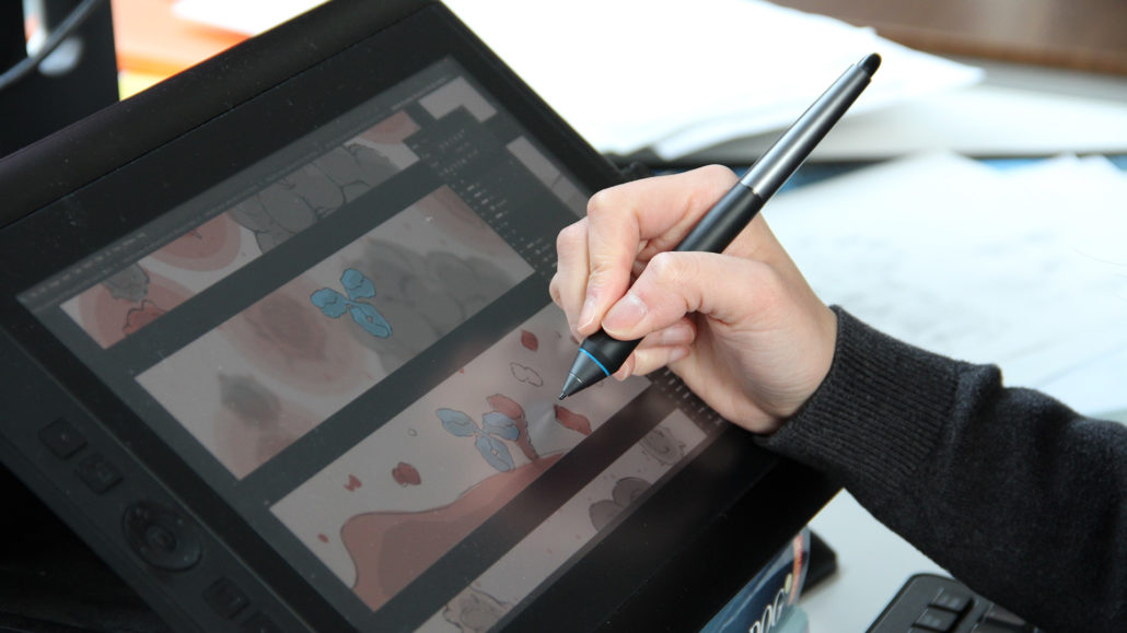 Studio photo: Drawing storyboards on a tablet.