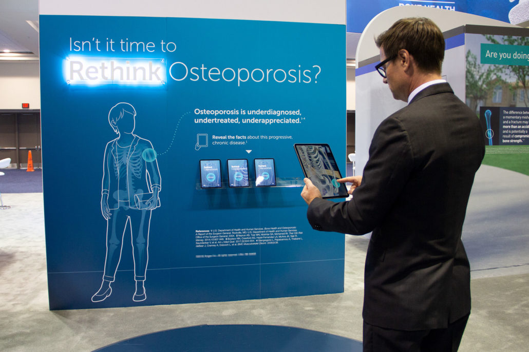 This is an augmented reality activity in which participants use an iPad to scan a virtual patient and her skeleton to find touchpoints. There are five touch points: hip; vertebra; wrist; humerus; clavicle. Tapping a touchpoint reveals information about fractures at that location and a question intended to spark discussion with an Amgen RML. This activity debuted at ASBMR 2019 in Orlando, FL.